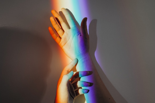 persons-hands-with-rainbow-colors-3693901