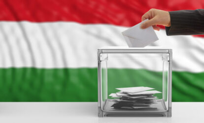 Hungary,Elections.,Voter,On,An,Waiving,Hungary,Flag,Background.,3d Ungarn nach der Wahl 2026 Wahlurne